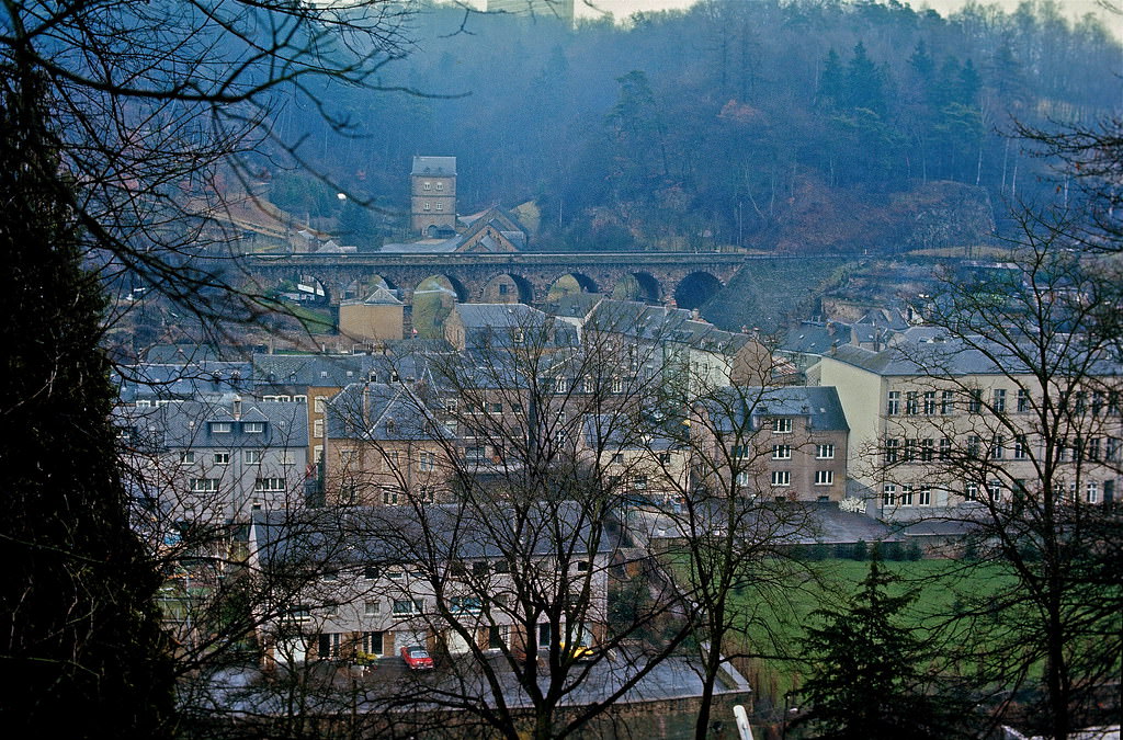 #39 The “Hiel”-valley in the lower district of Luxembourg-Pfaffenthal showing the Hiel-gate, the railway bridge and the primary school. Luxembourg City, Jan 1972.