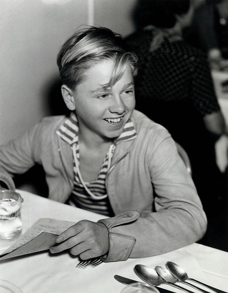 #28 Mickey Rooney about to order lunch in a restaurant, 1935.