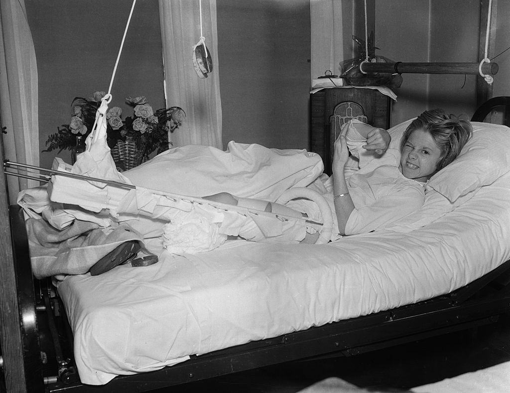 #29 Mickey Rooney in Hospital Bed with Broken Leg, 1935.