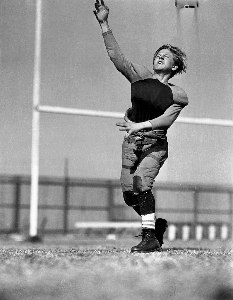 #31 Mickey Rooney throwing Football, 1935.
