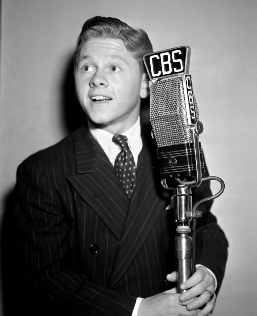 #47 Mickey Rooney at a CBS Radio microphone, 1938.