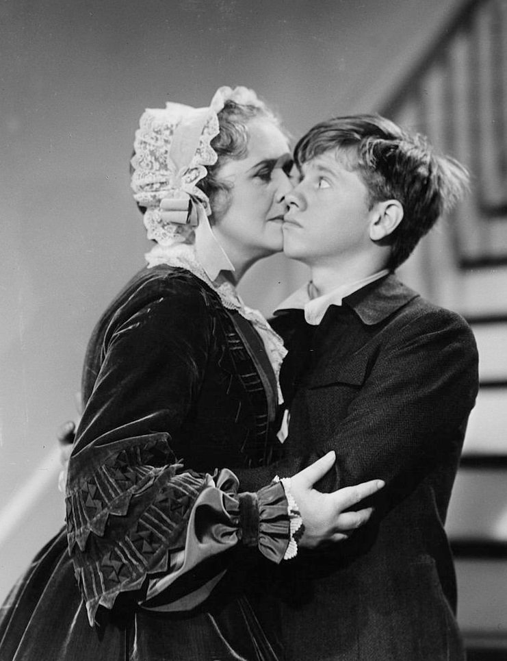 #55 Elizabeth Risdon kisses Mickey Rooney in a scene from the film ‘The Adventures Of Huckleberry Finn’, 1940.