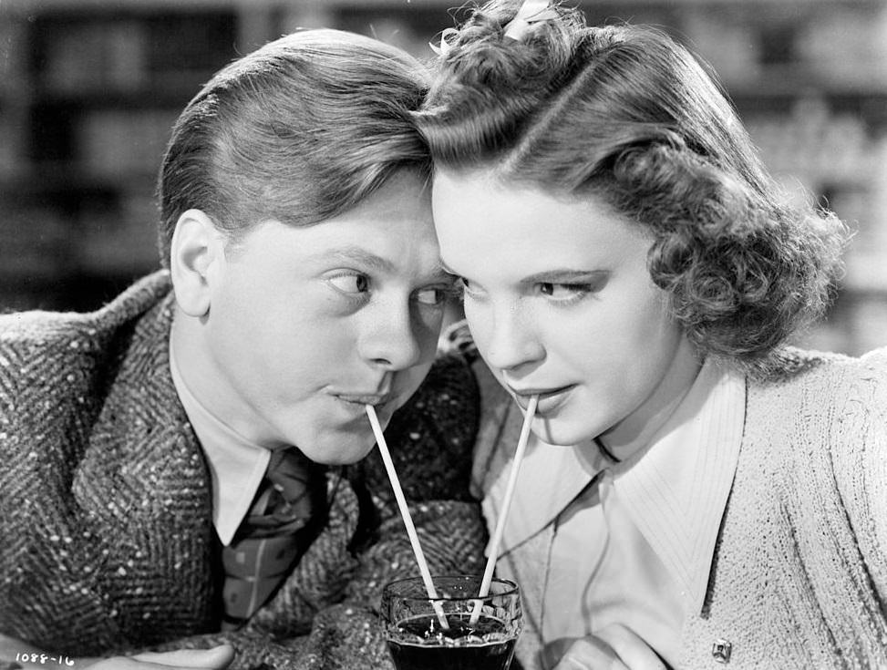 #56 Mickey Rooney and Judy Garland sharing a soda in a scene from the film ‘Babes In Arms’, 1939.