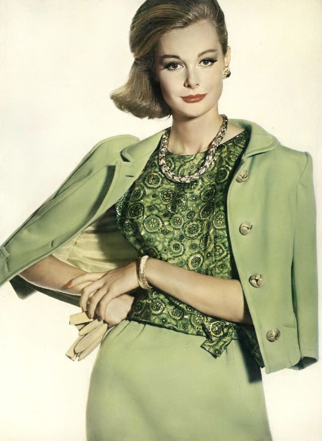 #8 Monique Chevalier in almond-green wool jersey suit with sleeveless silk paisley blouse, Vogue. December 1, 1961