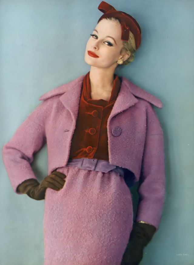 #2 Monique Chevalier in brilliant lilac wool tweed suit worn with a hat and blouse of ruby-red velvet, Vogue. November 1, 1958