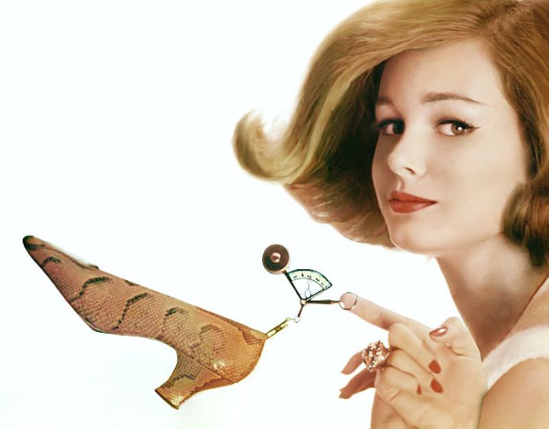 #15 Monique Chevalier holding Fleming-Joffe snakeskin shoe from small scale. Vogue, 1962