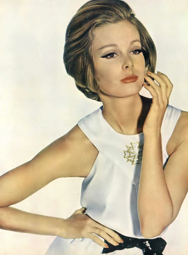 #19 Monique Chevalier in pure white short, full-skirted dress of silk crêpe, Vogue. May 1, 1962