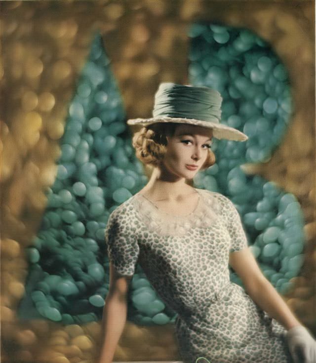 #20 Monique Chevalier in rayon crêpe dress in miniature apple print, Vogue. April 1, 1962