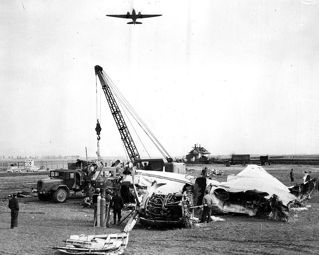 A crane removing the wreckage of the BEA Elizabethan airliner G-ALZU ‘Lord Burghley’ from Reim airport, Munich. 16th February 1958