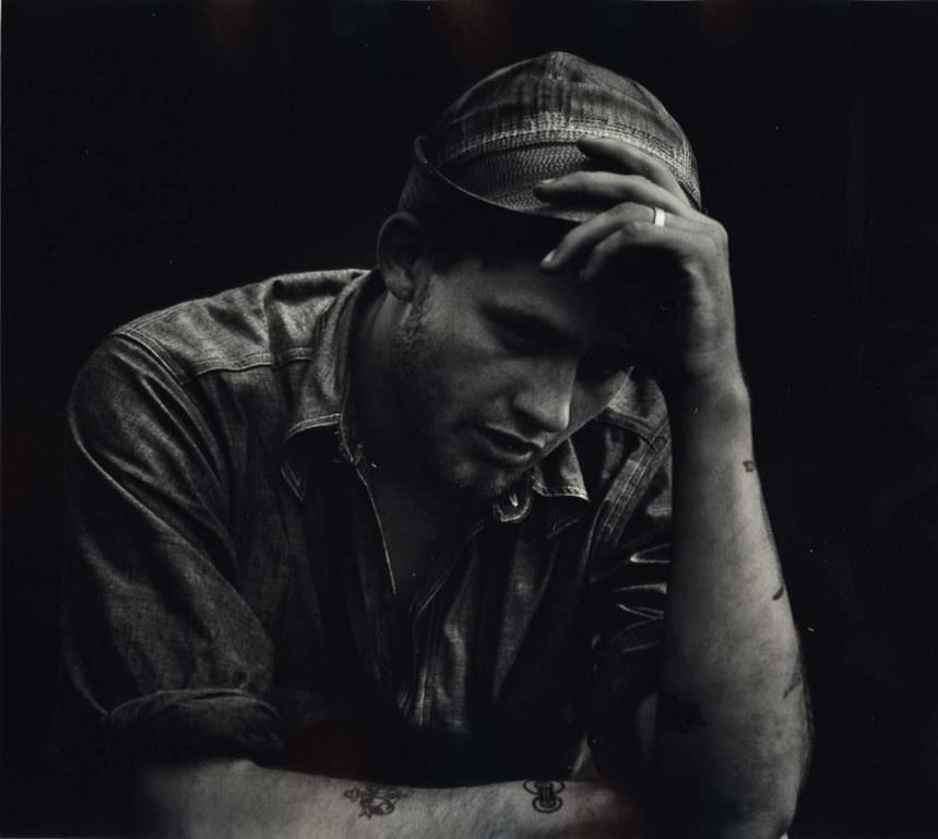 A man holding his hat, 1942-1945.
