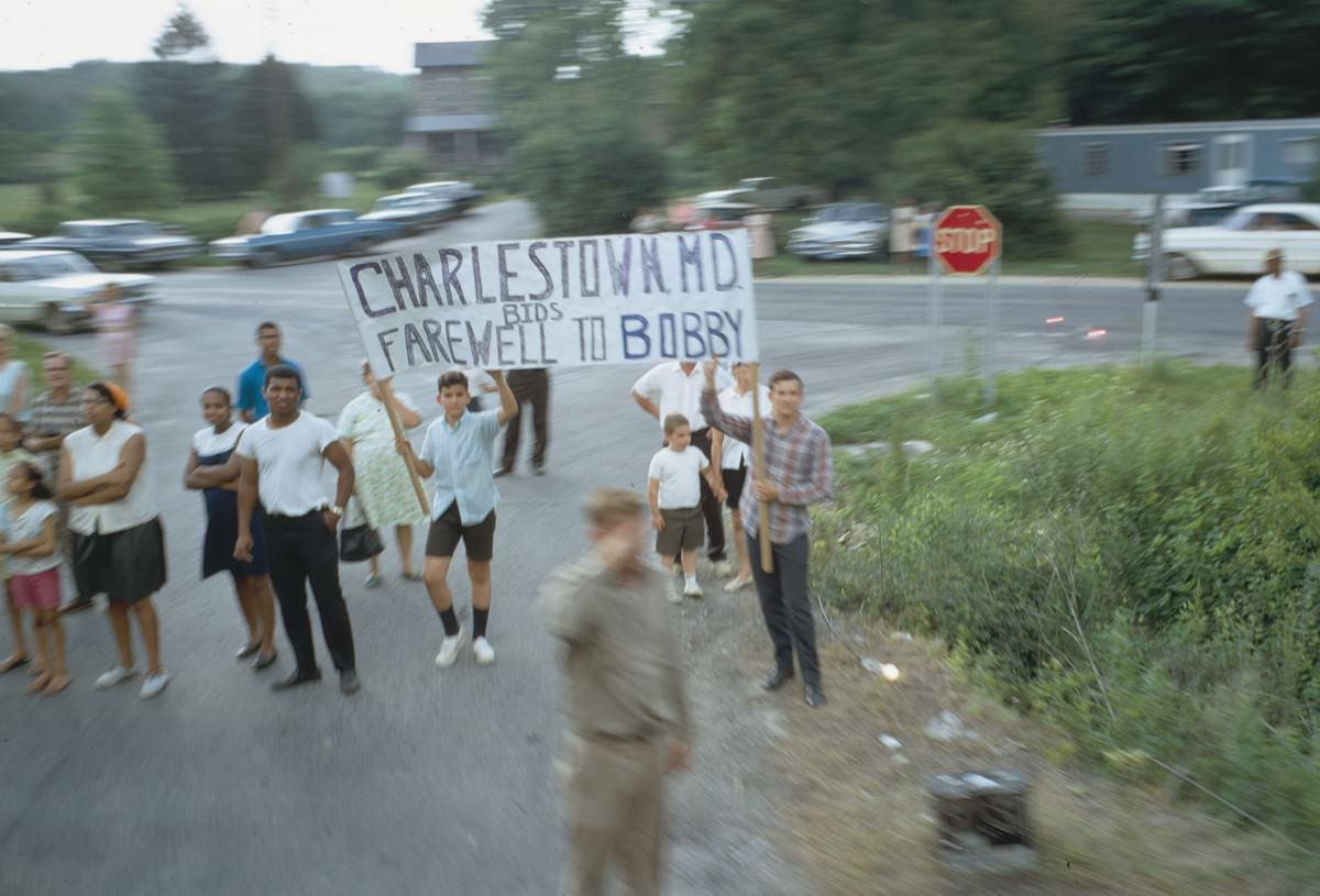 #16 A sign is held up as the funeral train passes through Charlestown, Maryland, on June 8, 1968