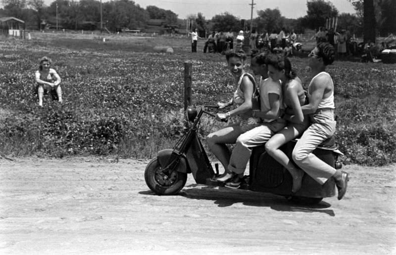 #4 A group of friends on a scooter.