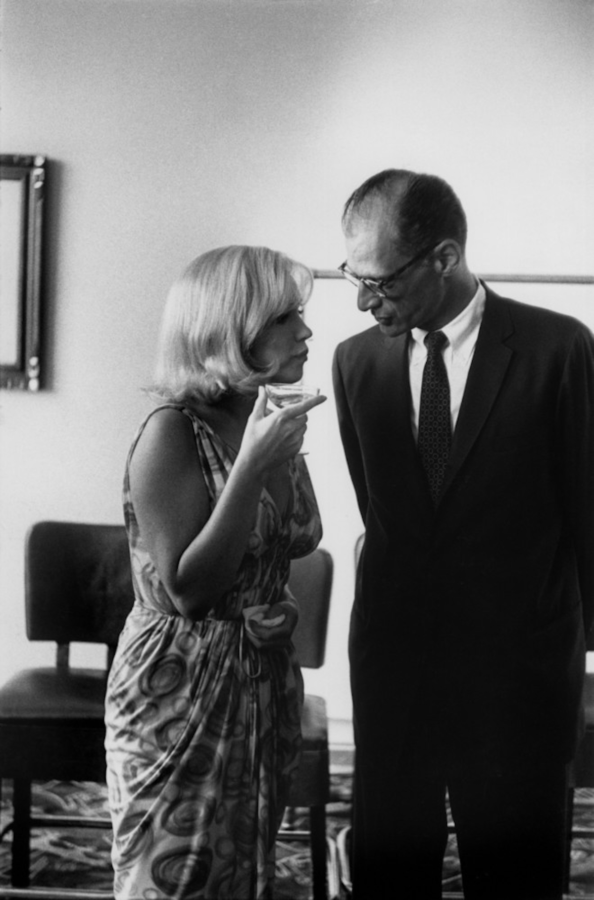 #36 Marilyn Monroe talking with Arthur Miller.