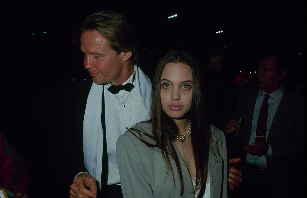 #10 Angelina Jolie with her father Actor Jon Voight, 1990.