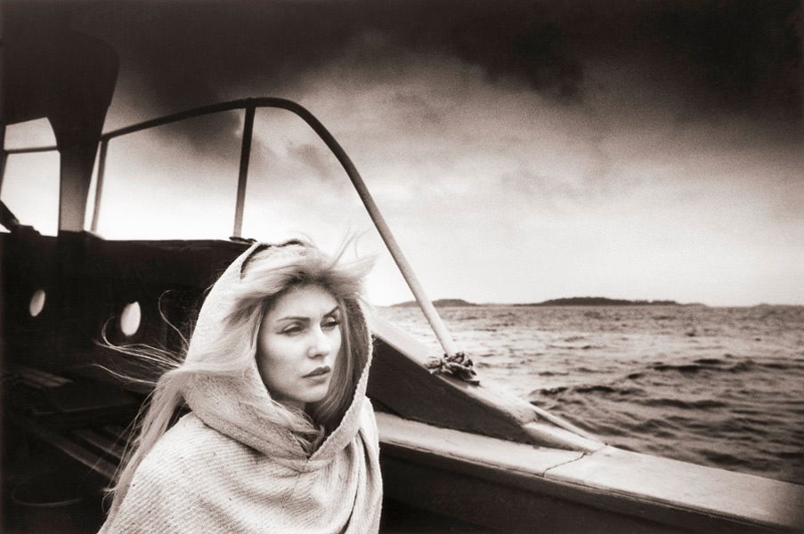 Debbie Harry pictured while travelling to the Scilly Isles to film the video for ‘Island of Lost Souls’, 1982.