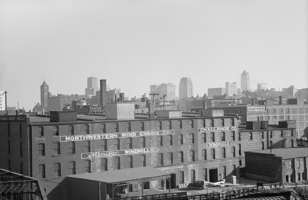 #81 Skyline with windmill company in foreground, Minneapolis, 1930s.
