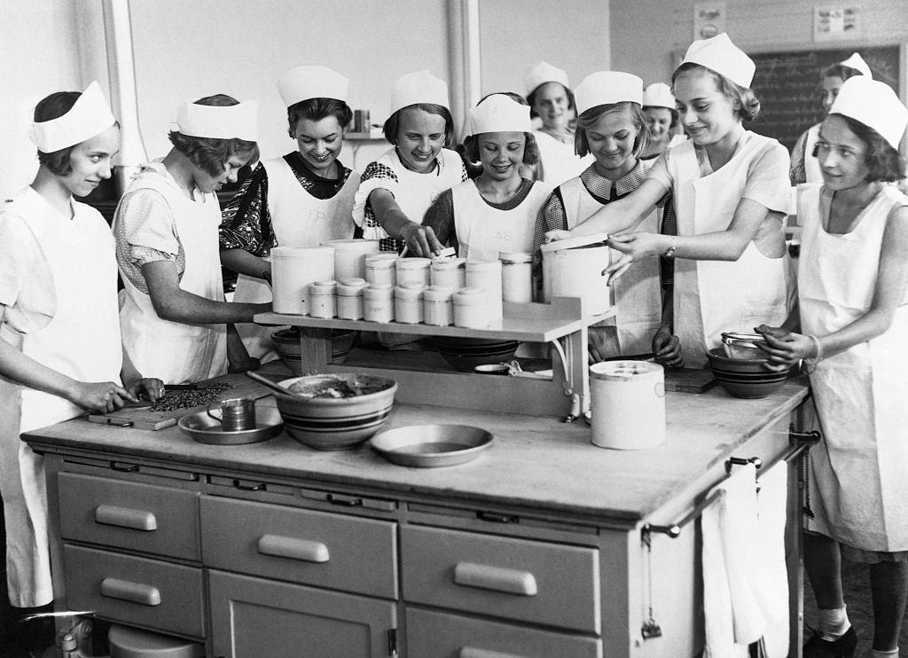 #87 Students work on a cooking project in a Home Economics class in a Junior High School, 1935.