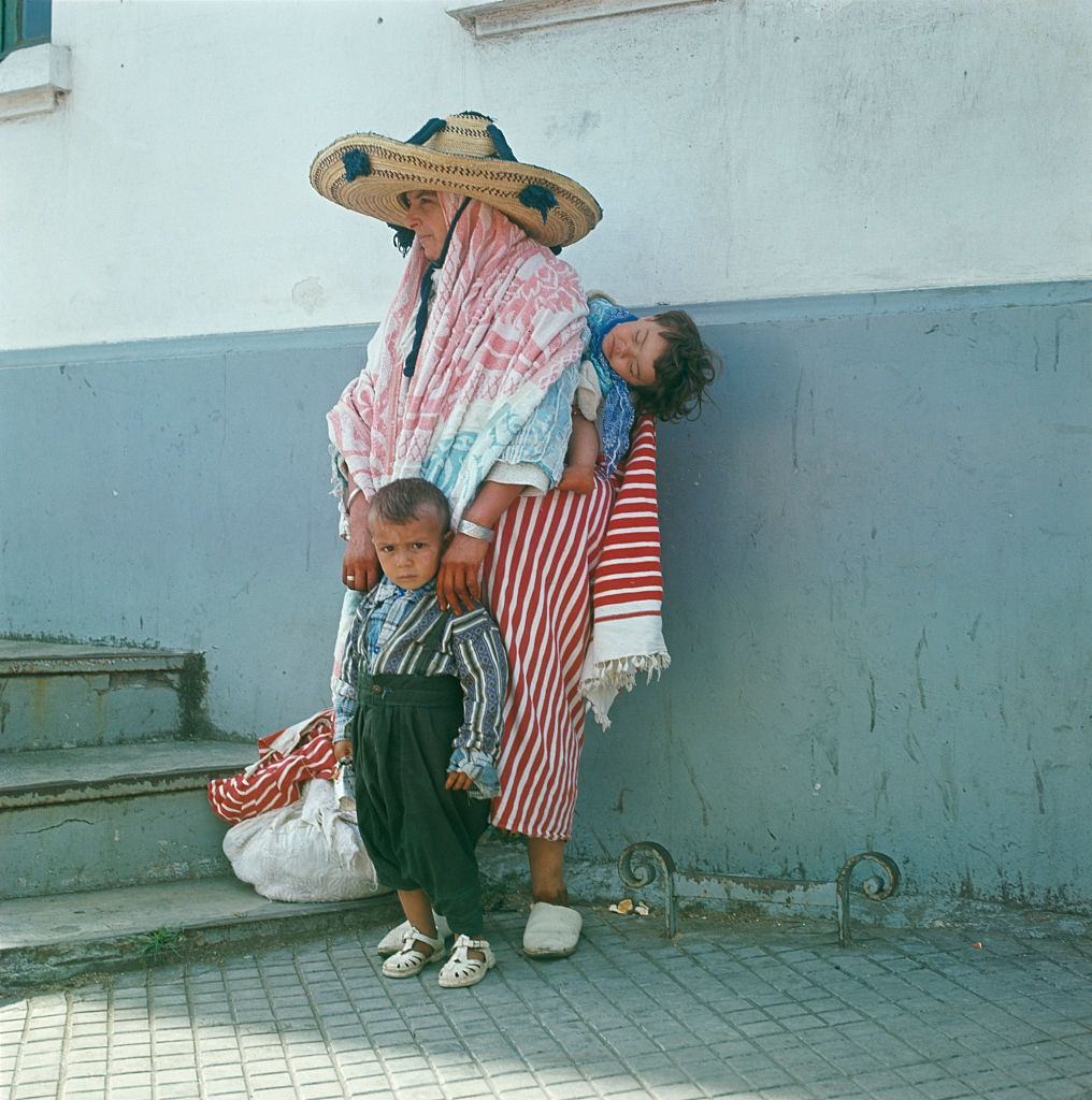 #67 A woman wearing a sombrero-style straw hat in Fez, Morocco, 1965.