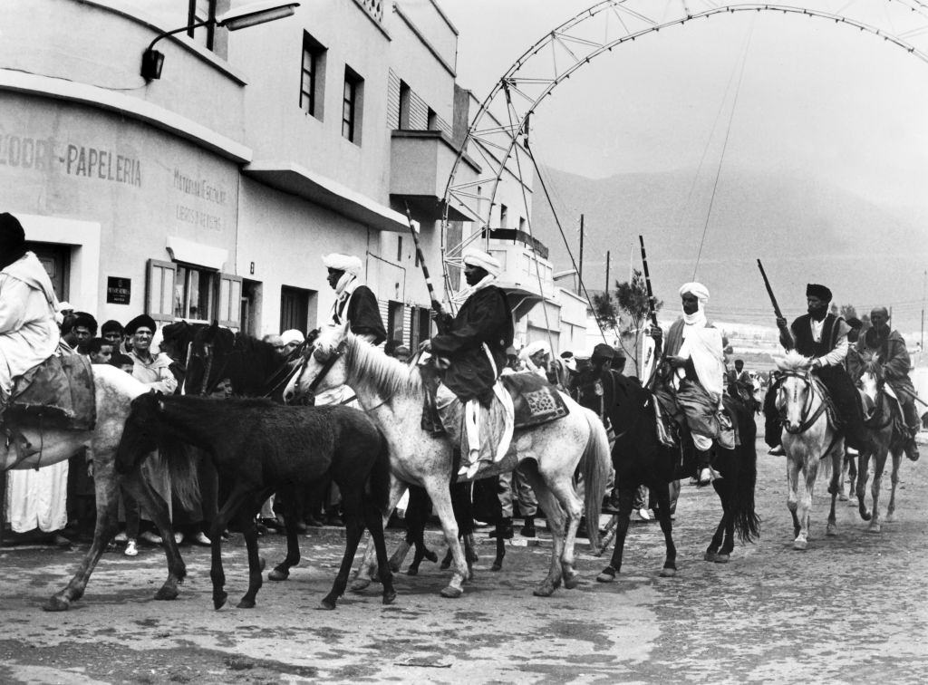 #87 Sidi Ifni inhabitants in traditional costumes enter the city after the departure of Spanish and the return of the territory to Morocco, on July 08, 1969.