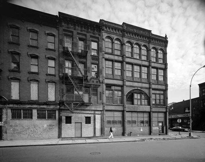 #17 Boarded-up buildings and the Bedford Avenue façade of the Smith Building, 123 South 8th Street, 1970s.