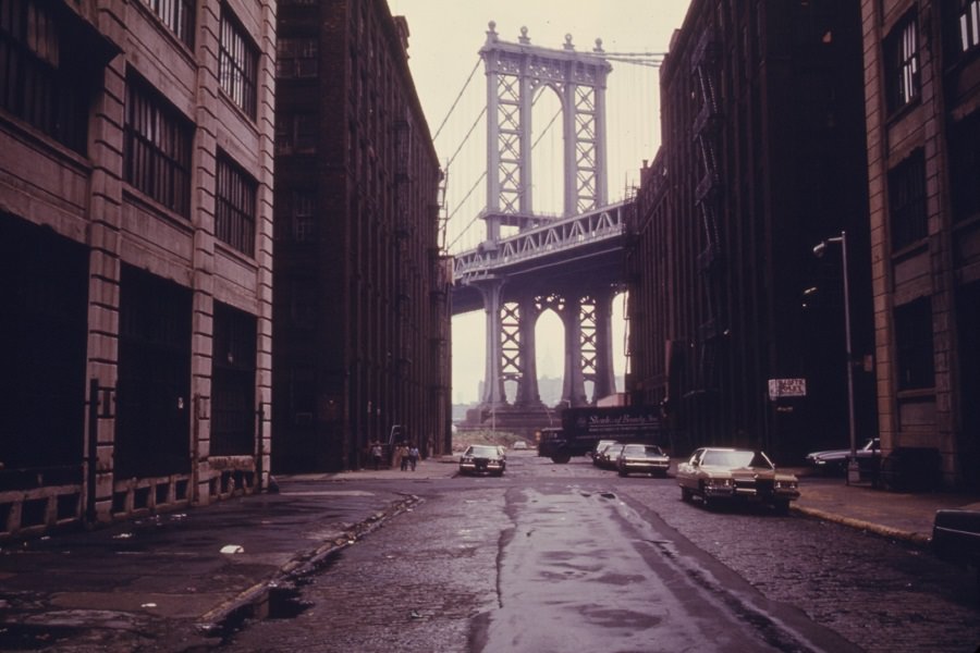 #9 Manhattan Bridge tower in Brooklyn, New York City, framed through nearby buildings, in June of 1974.