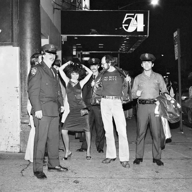 #13 A group of revellers pose as they leave world famous Studio 54