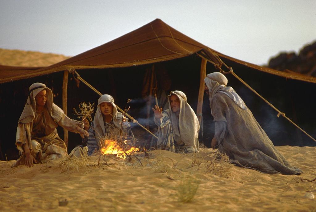 #2 Berber boys sit around a fire by a tent in Morocco, 1971.