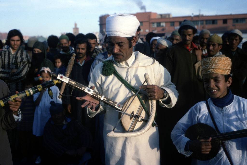 #26 Traditional musicians playing the kamânche on Jemaa el-Fna square in Marrakech, in January 1980.