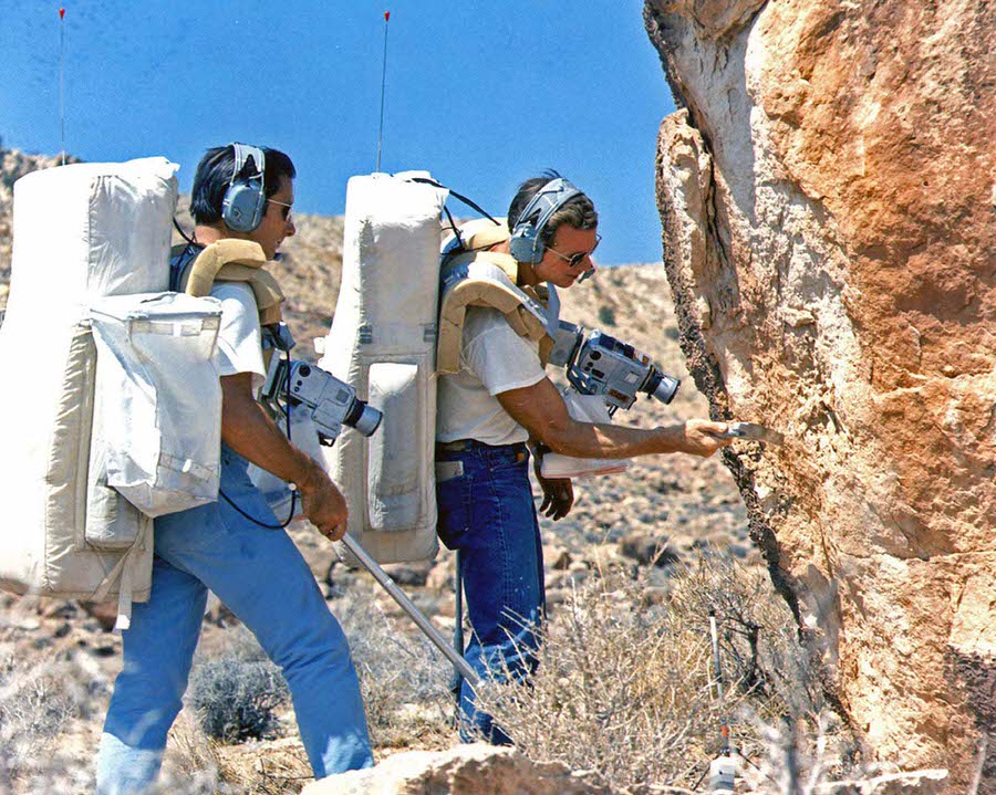 #11 The astronauts Jim Irwin and Dave Scott check out an outcrop during the final geology exercise for the Apollo 15 prime and backup crew at Coconino Point, Arizona, on June 25, 1971.