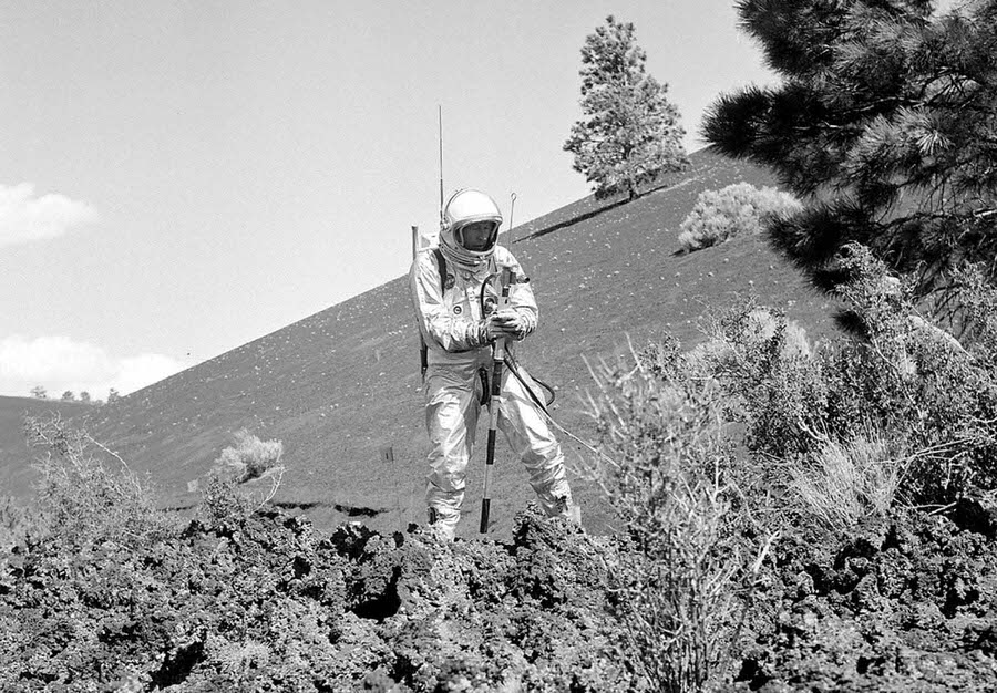 #9 A suited subject stands on the edge of the Bonito Lava Flow near Arizona’s Sunset Crater volcano, with an early concept of a “lunar staff” with a sun compass on top.