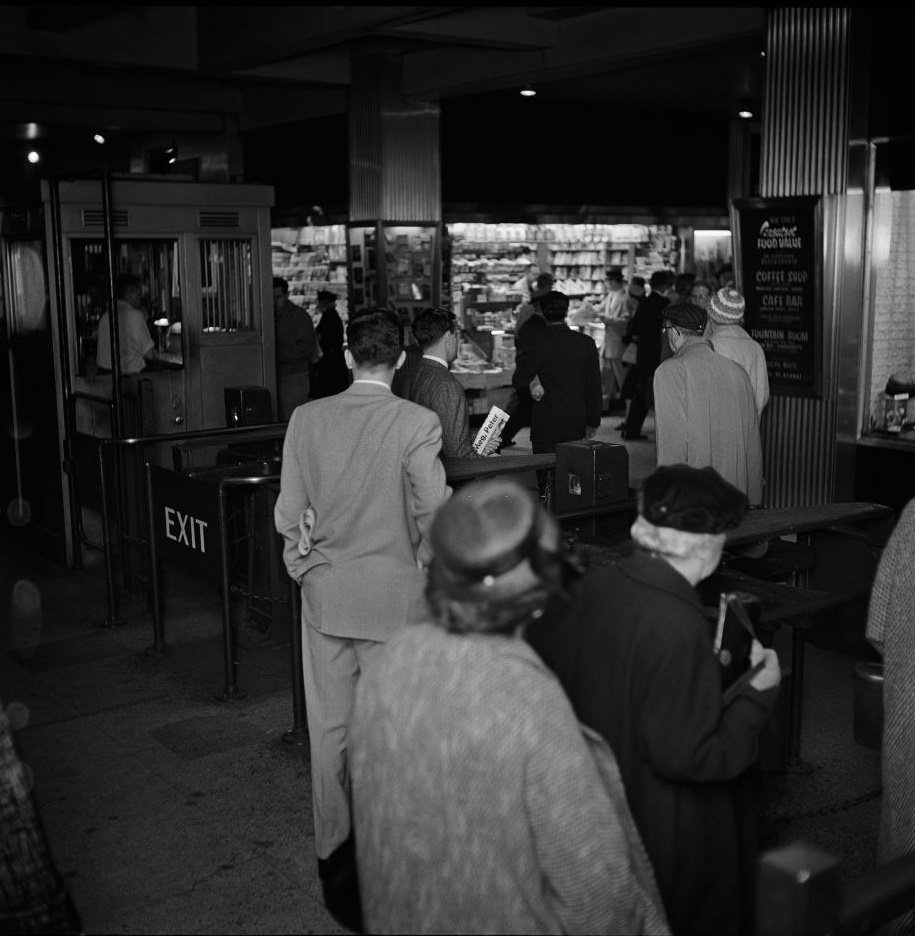 #18 Commuters enter a subway station in Brooklyn Heights, March 1958.