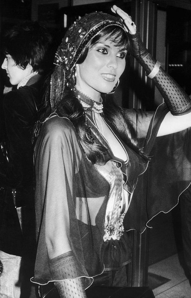 #8 Caroline Munro attending a film premier in London, 2nd April 1976.