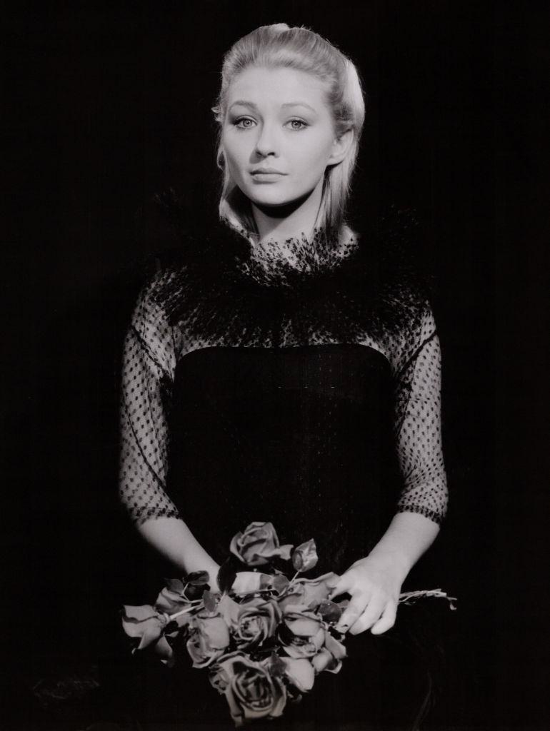 #28 Christine Kaufmann holding a rose bouquet, 1951