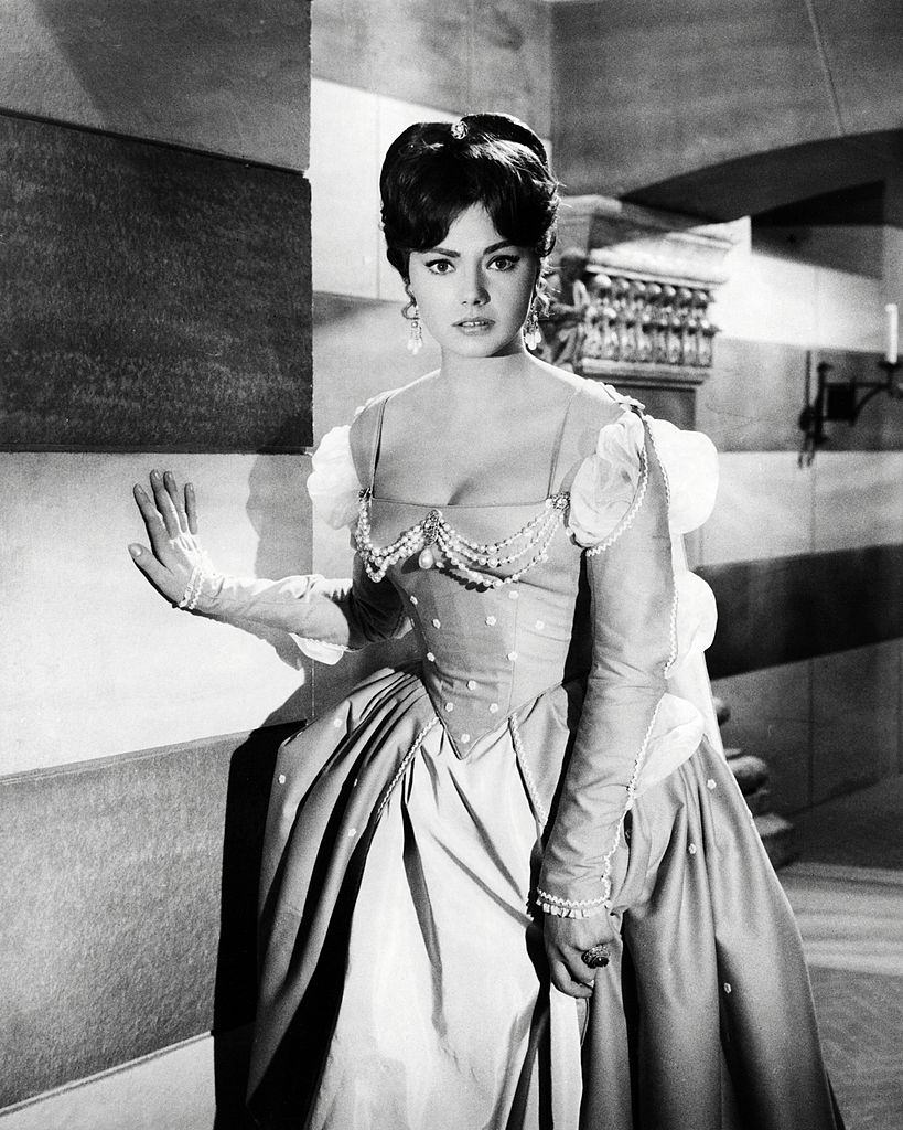 #30 Christine Kaufmann in period costume, as Serenella Arconti, in a promotional portrait for ‘Swordsman of Siena’, 1962.