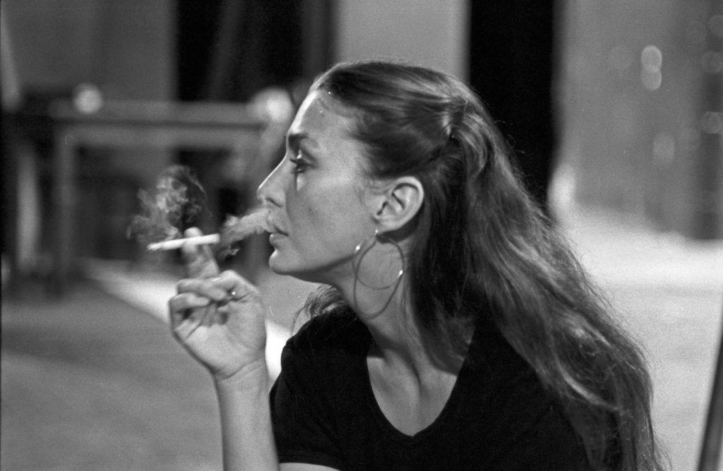 #49 Christine Kaufmann smokes a cigarette during the break at theater rehearsals, 1970s.