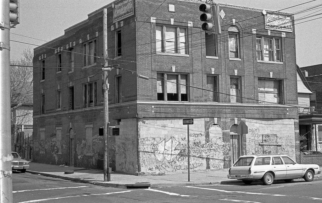 #7 A graffiti-covered, abandoned building at the intersection of 108th Street and 36th Avenue. Queens, New York, 1990.