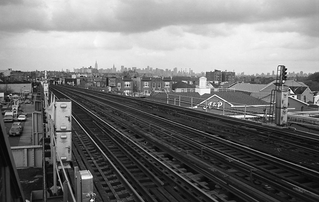 #16 New York City Skyline and surrounding cityscape from the elevated subway platform at 103rd Street in Corona, Queens, 1974.