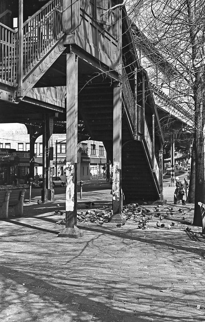 #20 Stairs leading to the elevated subway line on Roosevelt Avenue in Corona. Queens, New York, 1982.