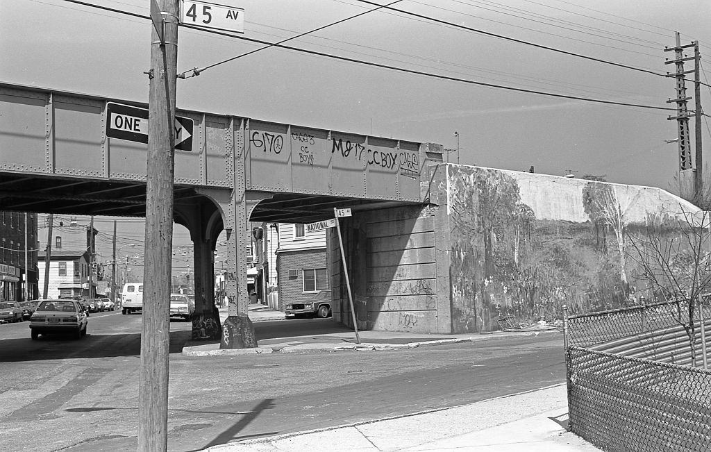 #22 Subway line at the intersection of 45th Avenue and National Street, in the Corona neighborhood, Queens. Queens, New York, 1982.