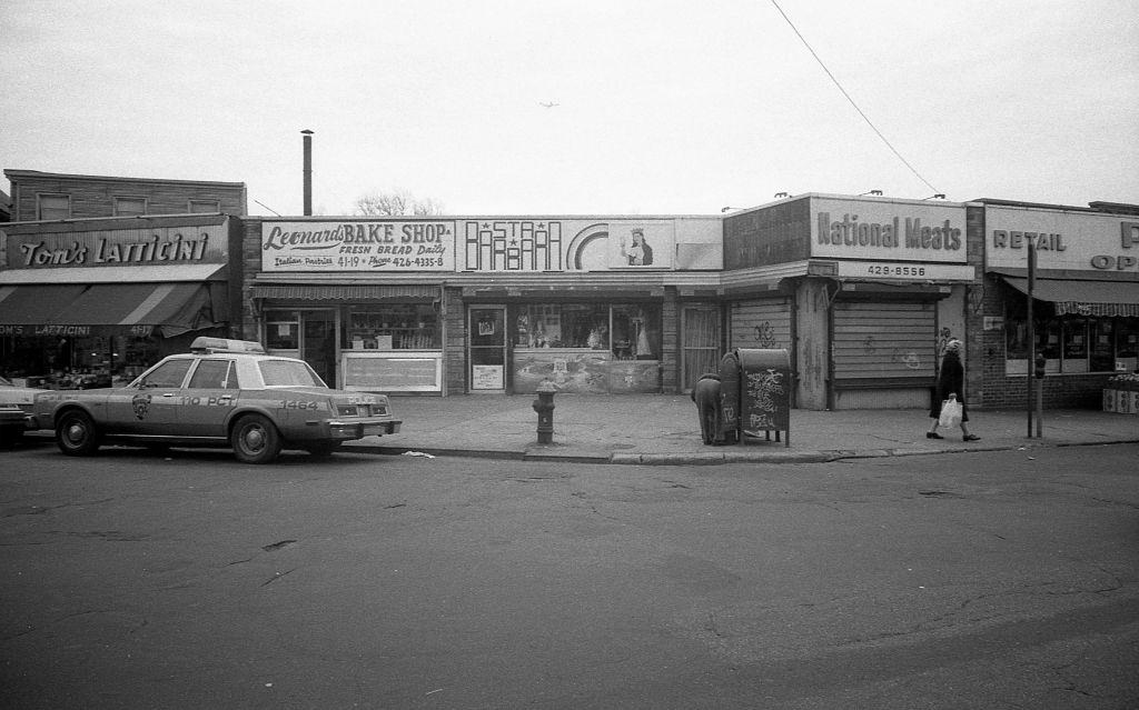 #4 Veteran’s Square park (at the intersection of 102nd and National streets), of various local businesses along 102nd Street, in the Corona. Queens, New York, 1982.