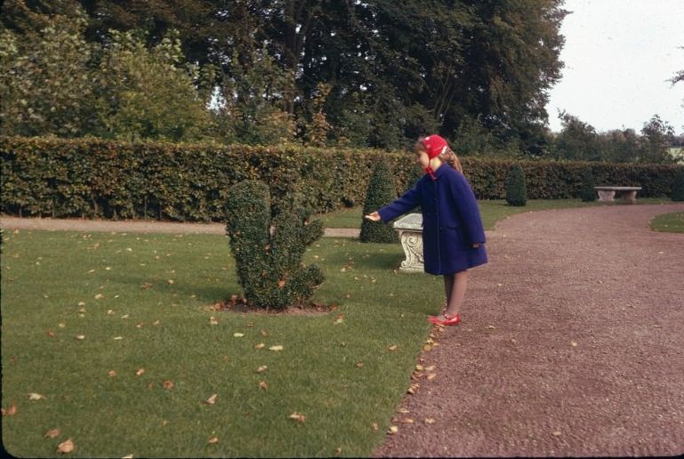 #15 Girl and a topiary squirrel in the renaissance garden at Egeskov Castle, Funen Island, Denmark