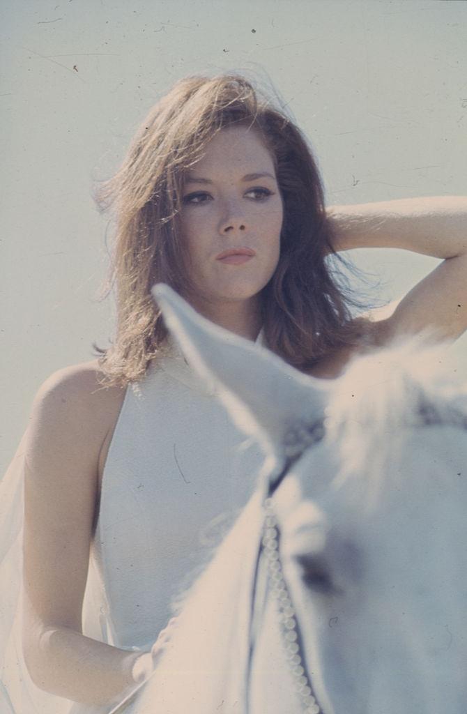 #37 Diana Rigg riding a horse, 1967.