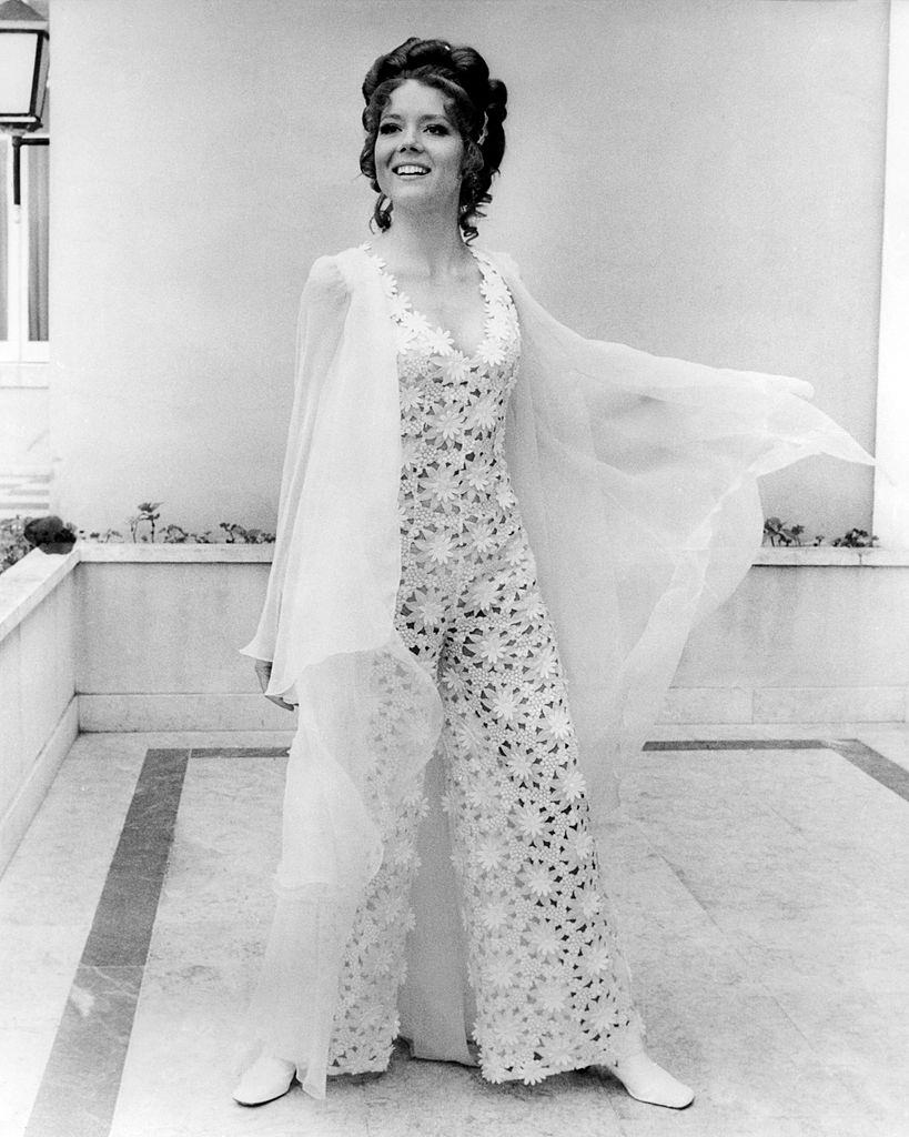 #57 Diana Rigg wearing a lace outfit in a promotional portrait for ‘On Her Majesty’s Secret Service’, 1969.