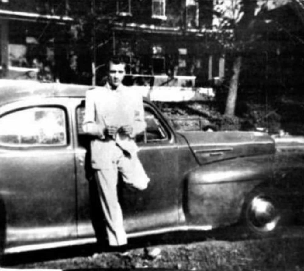 #1 Elvis with his first car, 1942 Lincoln Zephyr Coupe, the photo was taken in front of his home at 462 Alabama Avenue in Memphis.