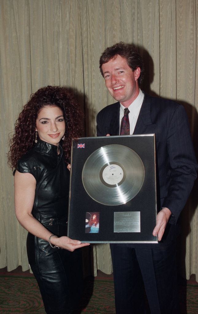 Gloria Estefan receives an award to recognise sales in the United Kingdom of more than 300,000 copies of her Epic album ‘Into the Light’, circa 1991.