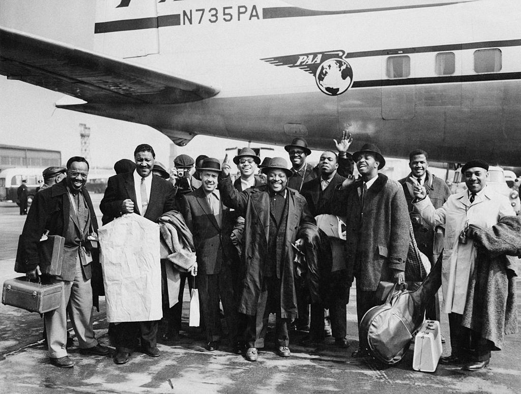 #11 American jazz musician Count Basie nd his orchestra arrive at London Airport for a tour of Britain, 4th April 1957.