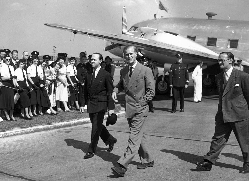 #12 The Duke Of Edinburgh arrives at Heathrow Airport, on leave from his naval duties in Malta for a holiday in Britain, 27th July 1950