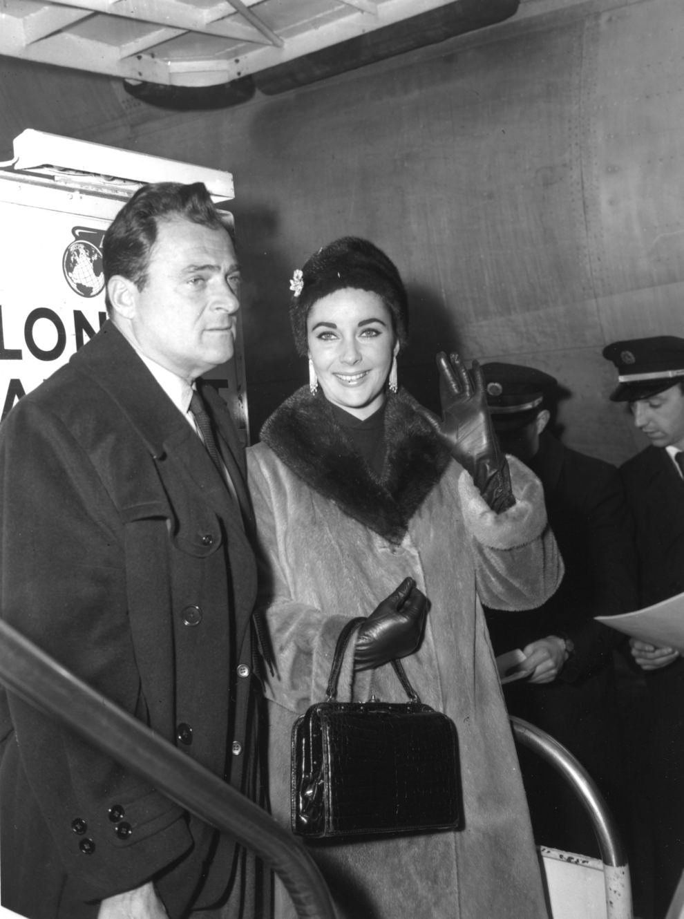 #31 Elizabeth Taylor and husband, film producer Mike Todd, arriving at Heathrow, 1958.
