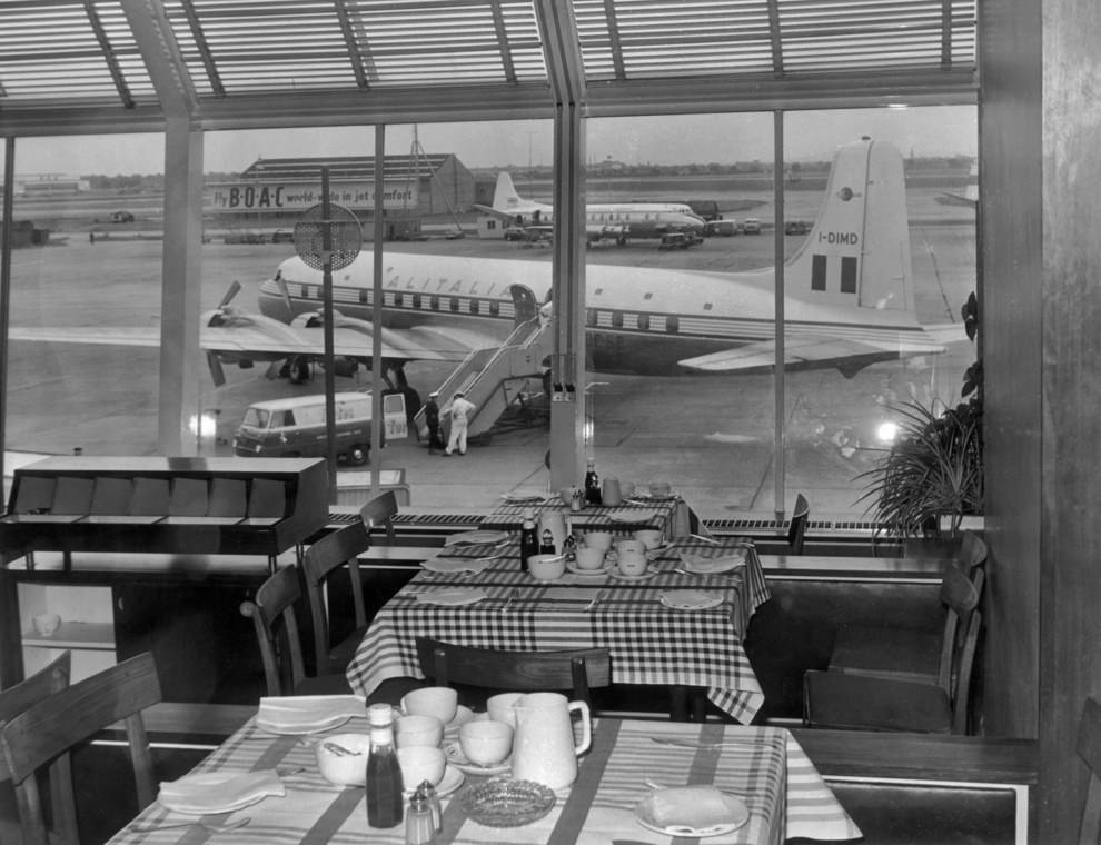#34 Airside, restaurant seating area overlooking apron, 1950s.