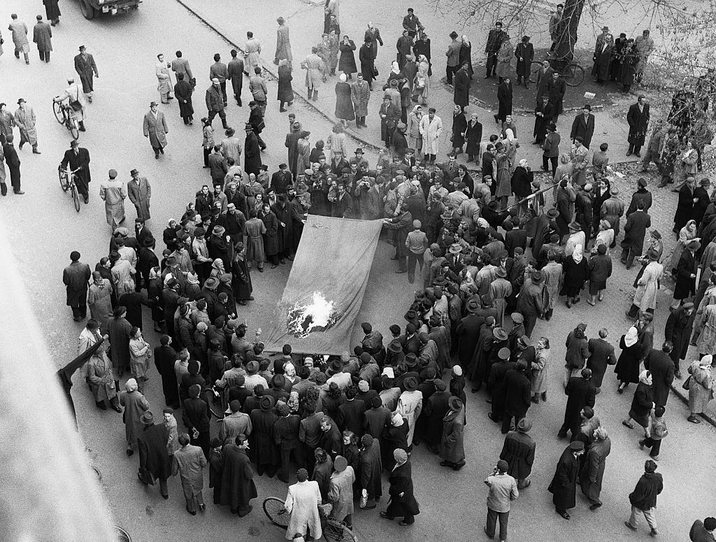 Hungarian Revolutionaries burning Russian Flag, 1956.